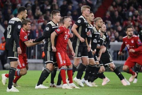 Champions League Match FC Bayern Munich Ajax Amsterdam 1 1 Thomas Müller and Franck Ribery stand in the wall of Amsterdam DFL regulations prohibit any use of images Munich Bayern Germany Allianz Arena