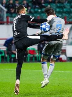 MOSCOW, RUSSIA â€“ OCTOBER 3, 2018: Lokomotiv Moscow s goalkeeper Guilherme Marinato (L) and FC Schalke 04 s Mark Uth in action in their 2018 19 UEFA Champions League Group D Round 2 football match at RZD Arena Stadium. FC Schalke 04 won the game 1:0. Sergei Fadeichev TASS  TS0926A4