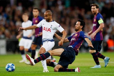 Barcelona s Sergio Busquets tackles Tottenham s Lucas Moura during the UEFA Champions League Group B match at Wembley Stadium, London. Picture date: 3rd October 2018. Picture credit should read: David Kein Sportimage EDITORIAL USE ONLY. No use with unauthorised audio, video, data, fixture lists, club league logos or live services. Online in-match use limited to 120 images, no video emulation. No use in betting, games or single club league player publications.