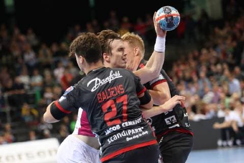 SG Flensburg Handewitt vs HC Motor Zaporozhye Handball EHF Champions League Group Stage 03 10 18 Pawel Paczkowski HC Motor Zaporozhye 22 against Dani Bajens SG Flensburg Handewitt 27 and Anders Zachariassen SG Flensburg Handewitt 22 xmmkx
