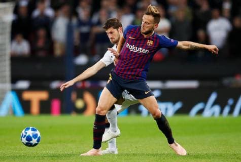 Barcelona s Ivan Rakitic battles with Tottenham s Ben Davies during the UEFA Champions League Group B match at Wembley Stadium, London. Picture date: 3rd October 2018. Picture credit should read: David Kein Sportimage EDITORIAL USE ONLY. No use with unauthorised audio, video, data, fixture lists, club league logos or live services. Online in-match use limited to 120 images, no video emulation. No use in betting, games or single club league player publications.