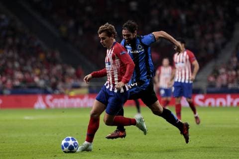 Atletico de Madrid s Antoine Griezmann and Club Brugge s Benoit Poulain during UEFA Champions League match between Atletico de Madrid and Club Brugge at Wanda Metropolitano Stadium in Madrid, Spain. October 03, 2018.  (201810030033)