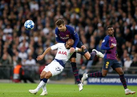 3rd October 2018, Wembley Stadium, London England; UEFA Champions League football, Tottenham Hotspur versus Barcelona; Gerard Pique of Barcelona challenges Lucas of Tottenham Hotspur to head the ball out  ActionPlus12067680 JohnxPatrickxFletcher