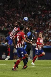3rd October 2018, Wanda Metropolitano, Madrid, Spain; UEFA Champions League football, Atletico Madrid versus Club Brugge; Benoit Poulain (Club Brugge KV) fights for the header with Thomas Teye Partey (Atletico de Madrid)  ActionPlus12067730 ShotxforxPress