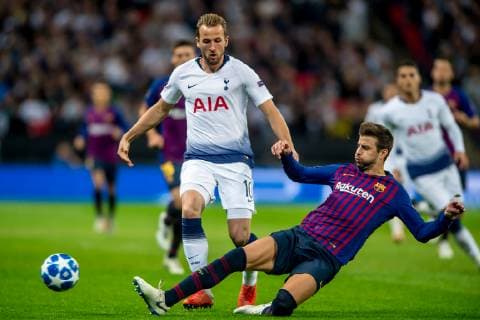 Harry Kane of Tottenham Hotspur and Gerard Pique of Barcelona during the UEFA Champions League Group Stage match between Tottenham Hotspur and Barcelona at Wembley Stadium, London, England on 3 October 2018. Editorial use only, license required for commercial use. No use in betting, games or a single club league player publications. Copyright: xSalvioxCalabresex 21440040