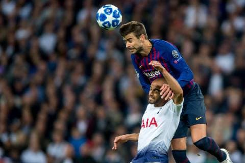 Gerard Pique of Barcelona challenges the ball with Lucas of Tottenham Hotspur during the UEFA Champions League Group Stage match between Tottenham Hotspur and Barcelona at Wembley Stadium, London, England on 3 October 2018. Editorial use only, license required for commercial use. No use in betting, games or a single club league player publications. Copyright: xSalvioxCalabresex 21440047