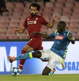 (181004) -- NAPLES, Oct. 4, 2018 -- Napoli s Kalodou Koulibaly (R) vies with Liverpool s Mohamed Salah during the UEFA Champions League Group C match between Napoli and Liverpool in Naples, Italy, Oct. 3, 2018. Napoli won 1-0. ) (SP)ITALY-NAPLES-FOOTBALL-UEFA CHAMPIONS LEAGUE-NAPOLI VS LIVERPOOL AlbertoxLingria 