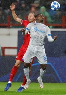 MOSCOW, RUSSIA - OCTOBER 03: Benedikt Howedes (L) of FC Lokomotiv Moscow and Breel Embolo of FC Schalke 04 vie for the ball during the Group D match of the UEFA Champions League between FC Lokomotiv Moscow and FC Schalke 04 at Lokomotiv Stadium on October 3, 2018 in Moscow, Russia. SPO, SOC, FOC 