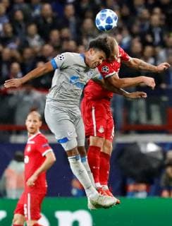 MOSCOW, RUSSIA - OCTOBER 03: Dmitri Barinov (R) of FC Lokomotiv Moscow and Weston McKennie of FC Schalke 04 vie for a header during the Group D match of the UEFA Champions League between FC Lokomotiv Moscow and FC Schalke 04 at Lokomotiv Stadium on October 3, 2018 in Moscow, Russia. SPO, SOC, FOC 