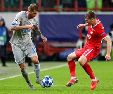 MOSCOW, RUSSIA - OCTOBER 03: Igor Denisov (R) of FC Lokomotiv Moscow and Guido Burgstaller of FC Schalke 04 vie for the ball during the Group D match of the UEFA Champions League between FC Lokomotiv Moscow and FC Schalke 04 at Lokomotiv Stadium on October 3, 2018 in Moscow, Russia. SPO, SOC, FOC 