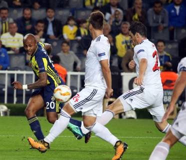 Andre Ayew of Fenerbahce and Matej Oravec 24 of Spartak Trnava during the UEFA Europa League Group D match between Fenerbahce and Spartak Trnava at Ulker Stadium in Istanbul , Turkey on October 04 , 2018 