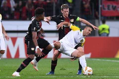 Football Europe League Group Stage 2 Gameday Bayer 04 Leverkusen AEK Larnaca at 04 10 2018 at the Leverkusen BayArena Leon Patrick Bailey Leverkusen front Joan Truyols Larnaka middle Lars Bender Leverkusen back DFL DFB regulations prohibit any use of images as image sequences or quasi video xRx
