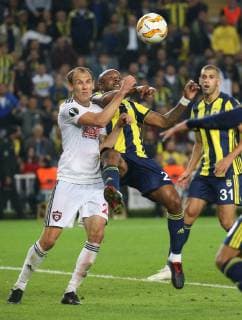 Andre Ayew of Fenerbahce and Martin Toth (L) of Spartak Trnava during the UEFA Europa League Group D match between Fenerbahce and Spartak Trnava at Ulker Stadium in Istanbul , Turkey on October 04 , 2018 