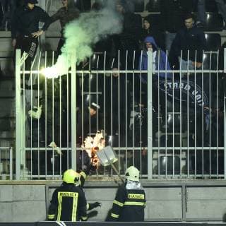 Firefighters intervene in a sector of FC Dynamo Kyiv soccer fans during the UEFA Europa League soccer match between FK Jablonec and FC Dynamo Kyiv, in Jablonec nad Nisou, Czech Republic, on October 4, 2018. (CTKxPhoto RadekxPetrasek) CTKPhotoP201810041066401  _PER6892