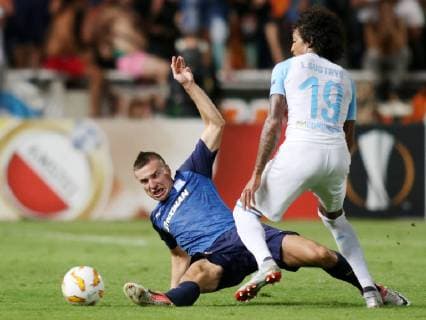 (181005) -- NICOSIA, Oct. 5, 2018 -- Luiz Gustavo (R) of Marseille vies with Sasa Markovic of Apollon during the Europa League Group H match between Apollon and Marseille in Nicosia, Cyprus on Oct. 4, 2018. Apollon drew 2-2 with Marseille. ) (SP)CYPRIS-NICOSIA-SOCCER-UEFA EUROPA LEAGUE-APOLLON VS MARSEILLE SakisxSavvides 