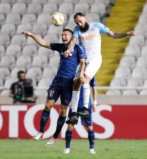 (181005) -- NICOSIA, Oct. 5, 2018 -- Kostas Mitroglou (R) of Marseille vies with Sasa Markovic of Apollon during the Europa League Group H match between Apollon and Marseille in Nicosia, Cyprus on Oct. 4, 2018. Apollon drew 2-2 with Marseille. ) (SP)CYPRIS-NICOSIA-SOCCER-UEFA EUROPA LEAGUE-APOLLON VS MARSEILLE SakisxSavvides 