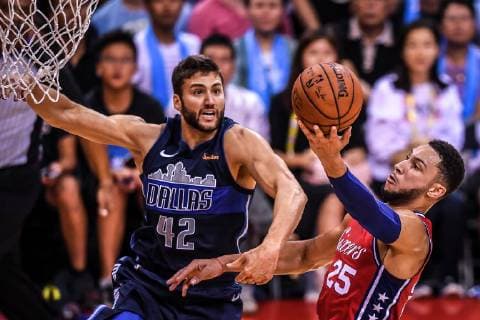Maxi Kleber of Dallas Mavericks, left, challenges Ben Simmons of Philadelphia 76ers during the Shenzhen match of the NBA Basketball Herren USA China Games in Shenzhen city, south China s Guangdong province, 8 October 2018. Mavericks beat 76ers 115-112 at Shenzhen match of NBA China Games. Dallas tops 76ers 115-112 at Shenzhen match of NBA China Games  pbu880987_03