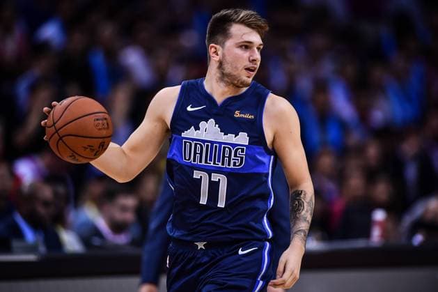 Luka Doncic of Dallas Mavericks dribbles against Philadelphia 76ers during the Shenzhen match of the NBA Basketball Herren USA China Games in Shenzhen city, south China s Guangdong province, 8 October 2018. Mavericks beat 76ers 115-112 at Shenzhen match of NBA China Games. Dallas tops 76ers 115-112 at Shenzhen match of NBA China Games  20181008_10995
