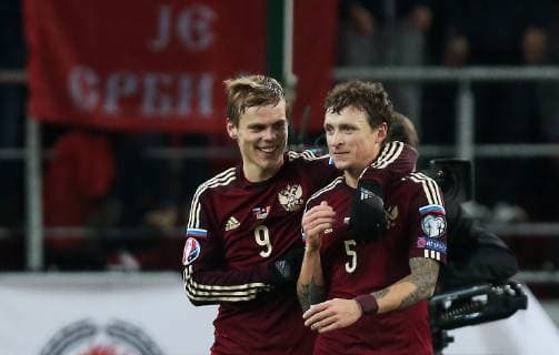 MOSCOW, RUSSIA. OCTOBER 9, 2018: Pictured in this file image dated October 12, 2015 are Russia s Alexander Kokorin (L) and Pavel Mamayev after winning their 2016 UEFA European Championship EM Europameisterschaft Qualifying Round Group G football match against Montenegro at Otkrytie Arena Stadium. The Russian team won the game 2:0. File image Artyom Korotayev TASS  TS093092