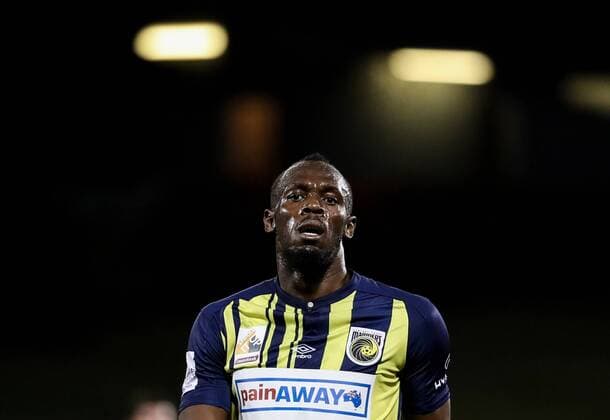 (181012) -- CAMPBELLTOWN, Oct. 12, 2018 -- Jamaican Olympic gold medalist Usain Bolt of Central Coast Mariners reacts during a charity football game between Central Coast Mariners and Macarthur South West United in Campbelltown, Australia, Oct. 12, 2018. Usain Bolt scored his first goals in professional football games on Friday. ) (SP)AUSTRALIA-CAMPBELLTOWN-SOCCER-CHARITY GAME-BOLT BaixXuefei 