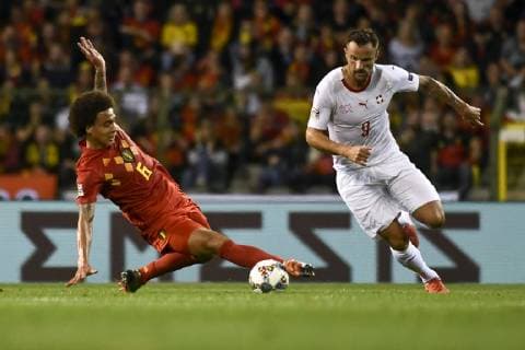 Belgium s Axel Witsel and Swiss Haris Seferovic fight for the ball during a soccer game between Belgian national team Nationalteam the Red Devils and Switzerland in Brussels, Friday 12 October 2018, the second game in group 2 of the UEFA Nations League A competition. DIRKxWAEM  x05446064x