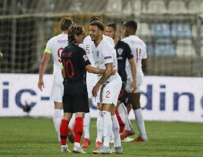 Luka Modric of Croatia smiles with Kyle Walker of England during the Uefa Nations League, Group A4 match at Stadion HNK Rijeka, Rijeka. Picture date: 12th October 2018. Picture credit should read: David Klein Sportimage EDITORIAL USE ONLY. No use with unauthorised audio, video, data, fixture lists, club league logos or live services. Online in-match use limited to 120 images, no video emulation. No use in betting, games or single club league player publications.