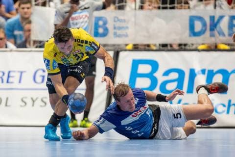 Alexander Patersson Nr 32 Rhein Neckar Löwen and Max Darj Nr 5 Bergischer HC in the fight for the ball on the ground Bergischer HC vs Rhein Neckar Löwen Handball DHB Cup Eighth finals 16 10 18 Solingen NRW Germany Klingenhalle Copyright: xdnet_cdnx