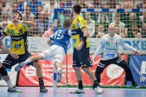 Tomas Babak No 19 Bergischer HC in throw against Gedeon Guardiola Villaplana Nr 30 Rhein Neckar Löwen and Mikael Alf Appelgren Nr 1 TW Rhein Neckar Löwen Bergischer HC vs Rhein Neckar Löwen Handball DHB Cup Eighth finals 16 10 18 Solingen NRW Germany Klingenhalle Copyright: xdnet_cdnx