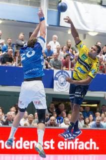 Csaba Szücs No. 20 Bergischer HC gets into the litter of Mads Mensah Larsen No. 22 Rhein Neckar Löwen Bergischer HC vs Rhein Neckar Löwen Handball DHB Cup Eighth finals 16 10 18 Solingen NRW Germany Klingenhalle Copyright: xdnet_cdnx
