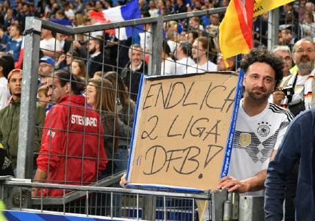 A fan shows a poster France Germany France Germany UEFA Nations Cup National Team DFB 2018 Soccer Soccer Soccer Men Germany France France Paris 16 10 2018