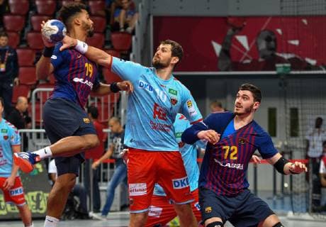 (181020) -- DOHA, Oct. 20, 2018 -- FC Barcelona Barca s Timothey Germain Guessan (L) competes during the final match of the 2018 IHF Super Globe World Handball Club Championship between Fuchse Berlin and FC Barcelona in Doha, Capital of Qatar, Oct. 19, 2018. FC Barcelona won 29-24 to claim the title. ) (SP)QATAR-DOHA-HANDBALL-IHF-SUPER GLOBE-FINAL MATCH Nikku 