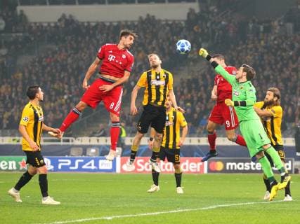 AEK Athens v Bayern Munich UEFA Champions League Vassilis Barkas of AEK Athens punches the ball in front of Javi Martinez of Bayern Munich during the UEFA Champions League match at Olympic Stadium, Athens Content Not Available For UK Newspapers Copyright: xYannisxHalasx FIL-12443-0032