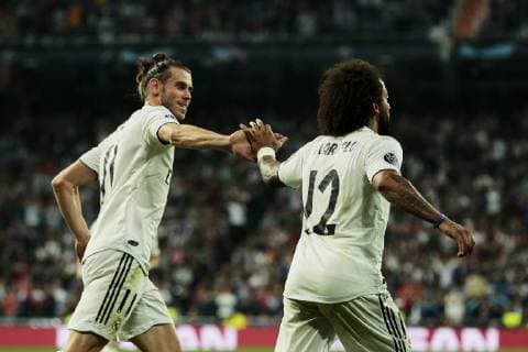 Real Madrid s Gareth Bale (L) and Marcelo Vieira (R) celebrate goal during UEFA Champions League match between Real Madrid and FC Viktoria Plzen at Santiago Bernabeu Stadium in Madrid, Spain. October 23, 2018.  (20181023041)