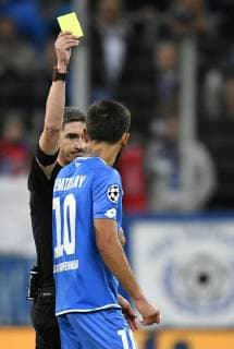 Referee referee Undiano Mallenco ESP shows Kerem Demirbay TSG 1899 Hoffenheim in the 4 minutes of added time yellow card yellow caution TSG 1899 Hoffenheim vs Olympique Lyon Champions League CL group stage 23 10 2018 DFL REGULATIONS PROHIBIT ANY USE OF PHOTOGRAPH AS IMAGE SEQUENCES AND OR QUASI VIDEO TSG 1899 Hoffenheim vs Olympique Lyon