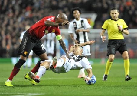 Manchester United ManU v Juventus UEFA Champions League Ashley Young of Manchester United fouls Cristiano Ronaldo of Juventus during the UEFA Champions League match at Old Trafford, Manchester Content Not Available For UK Newspapers Copyright: xStefanoxGnechx FIL-12450-0032