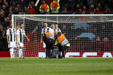 October 23, 2018 - Manchester, United Kingdom - Juventus forward Cristiano Ronaldo (7) supporters run into the pitch during the Uefa Champions League Group Stage football match n.3 Manchester United ManU - JUVENTUS on 23 10 2018 at the Old Trafford in Manchester, England. Manchester United v Juventus - UEFA Champions League Group H  - ZUMAn230 20181023_zaa_n230_463 Copyright: xMatteoxBottanellix