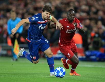 24th October 2018, Anfield, Liverpool, England; UEFA Champions League football, Liverpool versus Red Star Belgrade; El Fardou Ben Nabouhane of Red Star Belgrade and Sadio Mane of Liverpool race after the ball  ActionPlus12072936 DavidxBlunsden