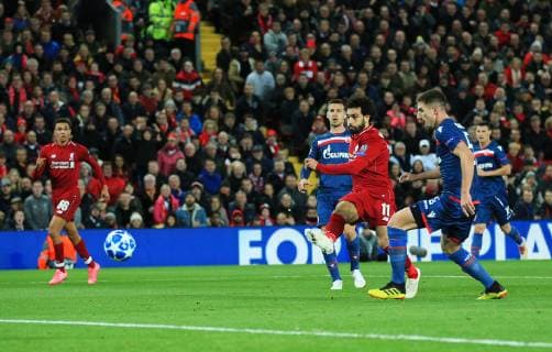 Liverpool s Mohamed Salah scores his teams second goal during the UEFA Champions League match at Anfield Stadium, Liverpool. Picture date 24th October 2018. Picture credit should read: Matt McNulty Sportimage EDITORIAL USE ONLY. No use with unauthorised audio, video, data, fixture lists, club league logos or live services. Online in-match use limited to 120 images, no video emulation. No use in betting, games or single club league player publications.