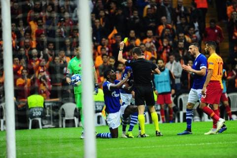 Referee Benoit Bastien show yellow card to Breel Embolo of FC Schalke 04 during the UEFA Champions League Group D match between Galatasaray and FC Schalke 04 at Turk Telekom Stadium in Istanbul , Turkey on October 24 , 2018. 