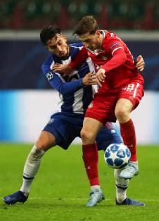 MOSCOW, RUSSIA â€“ OCTOBER 24, 2018: FC Portoâ€™s Alex Telles (L) and FC Lokomotiv Moscowâ€™s Alexei Miranchuk in their 2018 19 UEFA Champions League Group D Round 3 football match against at RZD Arena Stadium; FC Porto wins 3-1. Sergei Savostyanov TASS  TS095160