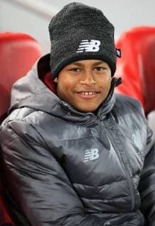 24th October 2018, Anfield, Liverpool, England; UEFA Champions League football, Liverpool versus Red Star Belgrade; Rhian Brewster of Liverpool looks on from his seat in the dugout  ActionPlus12073115 DavidxBlunsden