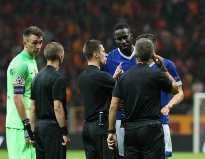 Referee Benoit Bastian and Salif Sane and Damiel Caligiuri of FC Schalke 04 during the UEFA Champions League Group D match between Galatasaray and FC Schalke 04 at Turk Telekom Stadium in Istanbul , Turkey on October 24 , 2018. 