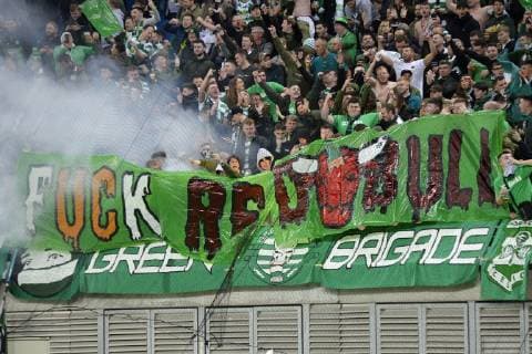 UEFA Europa League 2018 2019 Group Stage Group Stage 3 Gameday RB Leipzig vs Celtic FC Glasgow 25 10 2018 Celtic fans with Fuck Red Bull flag and pyrotechnics in the guest fan block Leipzig Saxony Germany