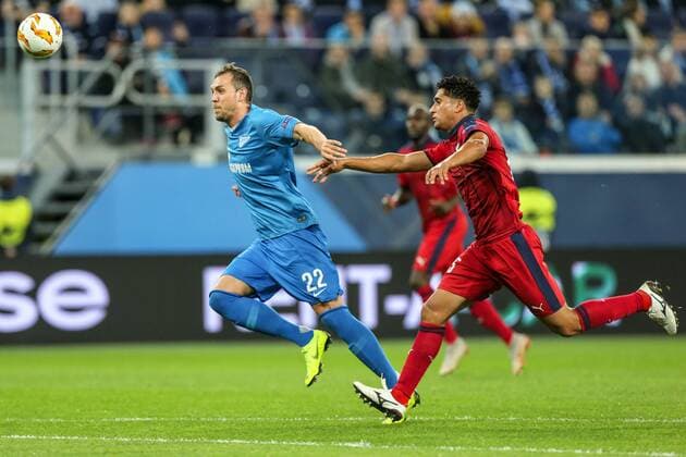 October 25, 2018 - Saint Petersburg, Russia - Artem Dzyuba of FC Zenit Saint Petersburg (L) and Otavio of FC Girondins de Bordeaux vie for the ball during the Group C match of the UEFA Europa League between FC Zenit Saint Petersburg and FC Girondins de Bordeaux at Saint Petersburg Stadium on October 25, 2018 in St.Petersburg, Russia. Zenit Saint Petersburg v FC Girondins de Bordeaux - UEFA Europa League: Group C  - ZUMAn230 20181025_zaa_n230_369 Copyright: xIgorxRussakx