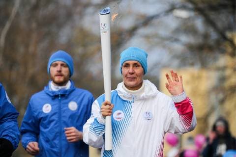 ST PETERSBURG, RUSSIA - OCTOBER 27, 2018: Six-time Olympic crosscountry skiing champion Lyubov Yegorova (front) takes part in the Krasnoyarsk Winter Universiade 2019 torch relay in central St Petersburg; the Winter Universiade torch relay started in Torino, Italy, on the 20th of September 2018 and is to move across 30 Russian cities; Krasnoyarsk is to host the 29th Winter Universiade in March 2019. Peter Kovalev TASS  TS0955B7