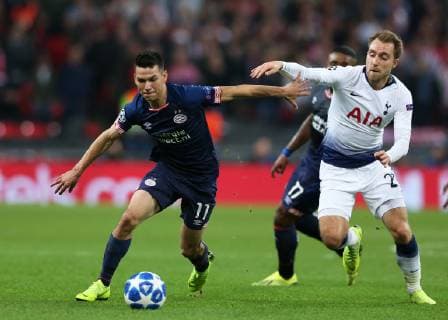 6th November 2018, Wembley Stadium, London England; UEFA Champions League football, Tottenham Hotspur versus PSV Eindhoven; Cristian Eriksen of Tottenham Hotspur challenges Hirving Lozano of PSV Eindhoven  ActionPlus12076880 JohnxPatrickxFletcher
