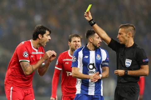 November 6, 2018 - Porto, Porto, Portugal - Davide Massa referee (L) shown a yellow card to Vedran Corluka defender of FC Lokomotiv Moscow (L) during the UEFA Champions League, match between FC Porto and FC Lokomotiv Moscow, at Dragao Stadium in Porto on November 6, 2018 in Porto, Portugal. FC Porto v FC Lokomotiv Moscow - UEFA Champions League Group D  - ZUMAn230 20181106_zaa_n230_327 Copyright: xDpix