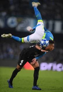 (181107) -- NAPLES, Nov. 7, 2018 (Xinhua) -- Paris Saint-Germain s Thilo Kherer (bottom) vies with Napoli s Jose Callejon during the UEFA Champions League Group C match between Napoli and PSG in Naples, Italy, Nov. 6, 2018. The match tied 1-1. (Xinhua Alberto Lingria) (SP)ITALY-NAPLES-SOCCER-UEFA CHAMPIONS LEAGUE-NAPOLI VS PSG 