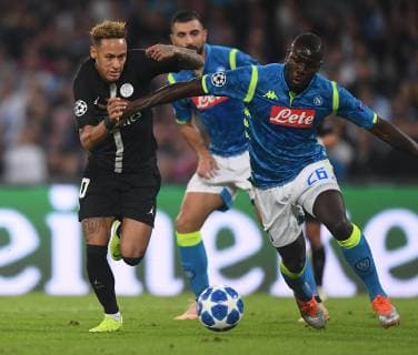 (181107) -- NAPLES, Nov. 7, 2018 (Xinhua) -- Paris Saint-Germain s Neymar (L) vies with Napoli s Kalidou Koulibaly during the UEFA Champions League Group C match between Napoli and PSG in Naples, Italy, Nov. 6, 2018. The match tied 1-1. (Xinhua Alberto Lingria) (SP)ITALY-NAPLES-SOCCER-UEFA CHAMPIONS LEAGUE-NAPOLI VS PSG 