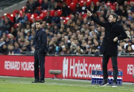 (181107) -- LONDON, Nov. 7, 2018 (Xinhua) -- Tottenham Hotspur s manager Mauricio Pochettino (L) and Eindhoven s manager Mark Van Bommel gesture during the UEFA Champions League match between Tottenham Hotspur and PSV Eindhoven in London, Britain on Nov. 6, 2018. Tottenham Hotspur won 2-1. (Xinhua Han Yan) FOR EDITORIAL USE ONLY. NOT FOR SALE FOR MARKETING OR ADVERTISING CAMPAIGNS. NO USE WITH UNAUTHORIZED AUDIO, VIDEO, DATA, FIXTURE LISTS, CLUB LEAGUE LOGOS OR LIVE SERVICES. ONLINE IN-MATCH USE LIMITED TO 45 IMAGES, NO VIDEO EMULATION. NO USE IN BETTING, GAMES OR SINGLE CLUB LEAGUE PLAYER PUBLICATIONS. (SP) BRITAIN-LONDON-FOOTBALL-CHAMPIONS LEAGUE-HOTSPUR VS EINDHOVEN